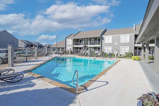 Our sparkling swimming pool surrounded by apartments at The Oasis apartments in Bossier City, LA