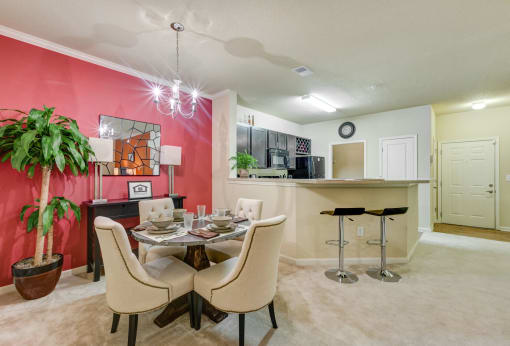 Dining Room with Wall-to-Wall Carpeting at Patriot Park Apartment Homes in Fayetteville, NC,28311