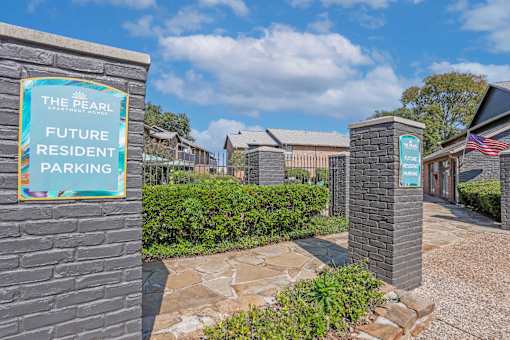 A sign for The Pearl Apartments Future Resident Parking is displayed.
