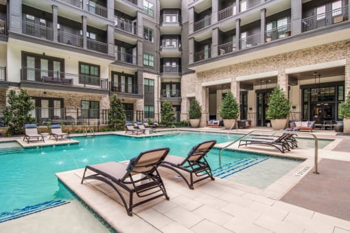 Poolside Seating at The Alastair at Aria Village Apartment Homes in Sandy Springs, Georgia, GA