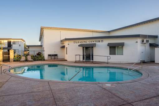 A pool in front of a building that says "cleansing center".