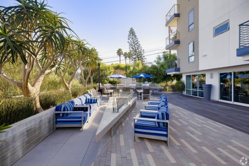 a lounge area with blue chairs
