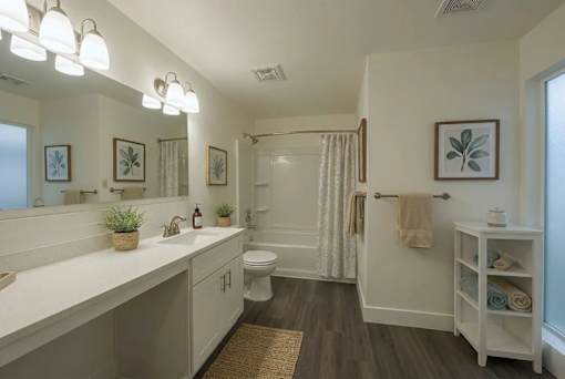 A bathroom with a white counter and a white toilet.