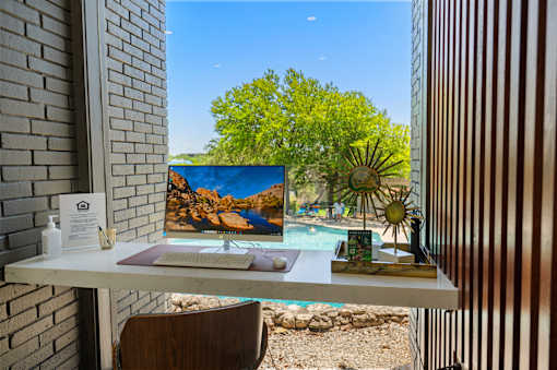 Workspace desk with scenic outdoor view at Skyline at Barton Creek Apartments, Austin, Texas