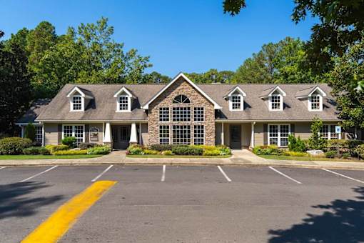 A building with a parking lot in front of it.