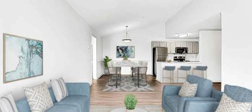 A living room with a dining area in the background.