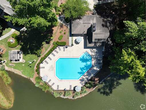 An aerial view of a house with a swimming pool.