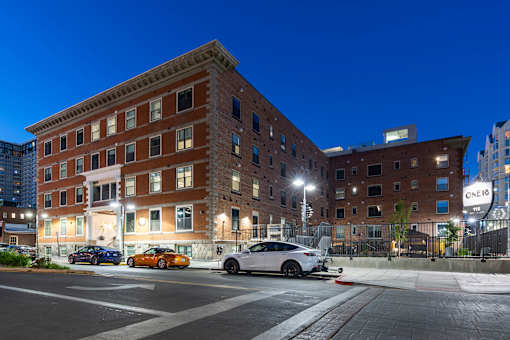 A building with a car parked in front of it.