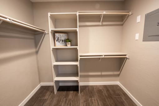 large closet with shelves and clothes rod