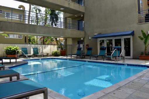 Community pool with lounge chairs
