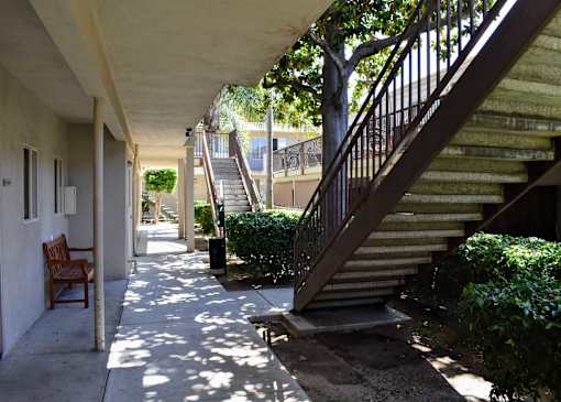 shaded walkway underneath stairs