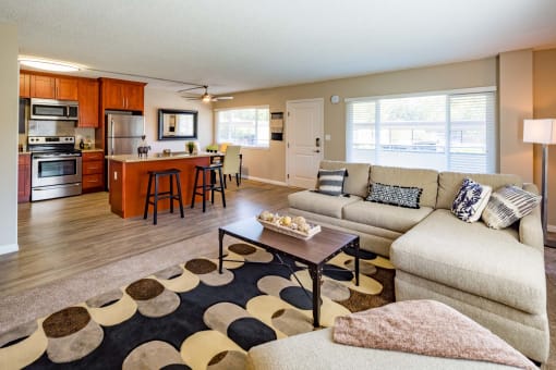 furnished living room with large sectional couch