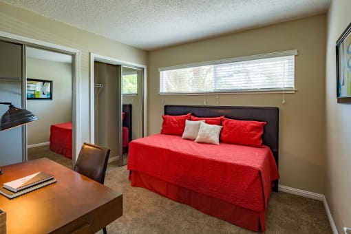 furnished bedroom with large window