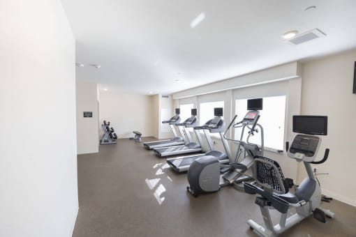 the gym has cardio equipment and treadmills in it at Parks Residential - Richardson, Richardson, 75082