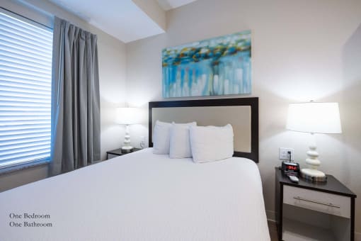 a bedroom with a large bed and a window at Parks Residential - Richardson, Texas