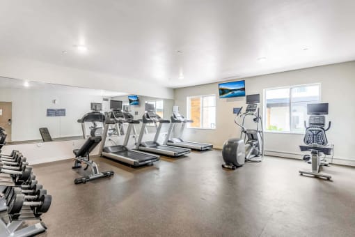 the gym with treadmills and other exercise equipment at the belgard apartments at Parks Residential - Denver, Centennial, 80111