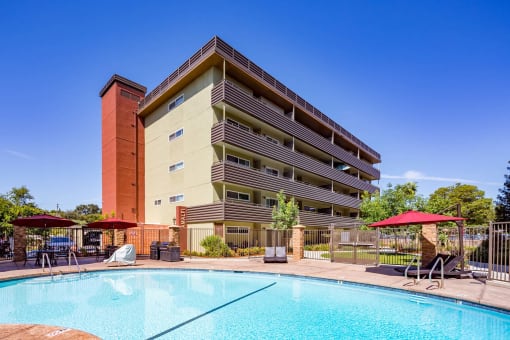 community pool and lounge chairs