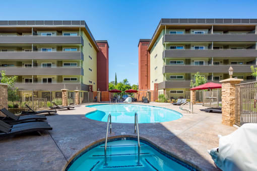 community pool and lounge chairs
