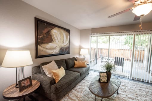 View of living room overlooking the private patio/ balcony