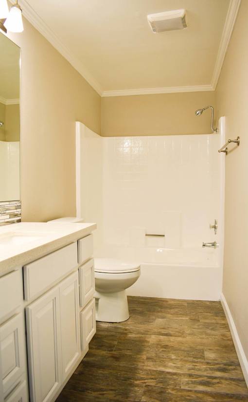 Large bathroom with hardwood floors