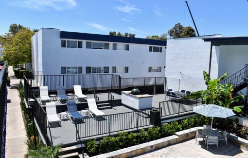 Ariel view of lounging and grilling area located close to the pool