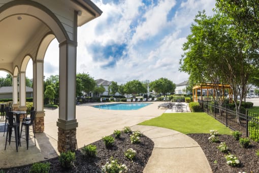 the enclave at green valley ranch clubhouse with pool and patio