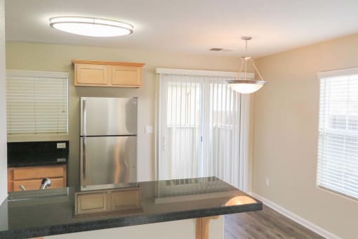 view from living room into kitchen showing wood floors