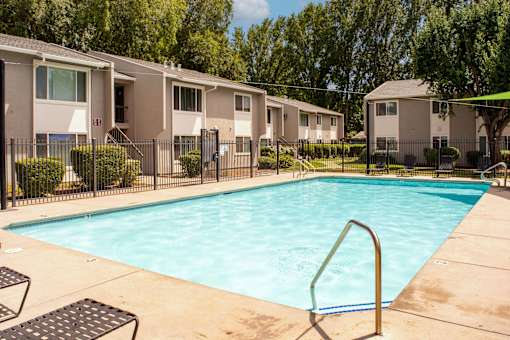 our apartments have a swimming pool with a fence around it