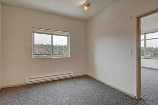 A room with a window and a door.