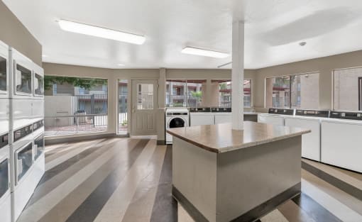 a large kitchen with an island and a lot of windows at Glen Brae, Arizona