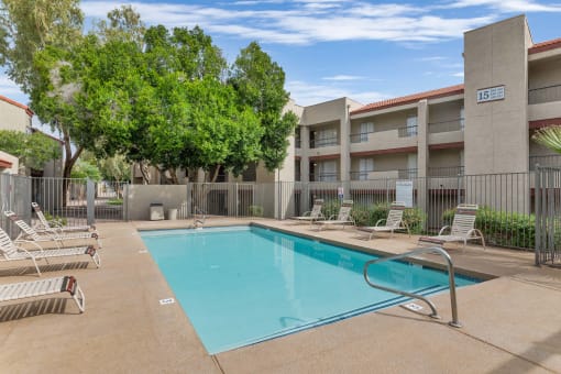 our apartments have a swimming pool with chairsat Glen Brae, Glendale, AZ, 85301