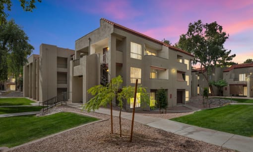 an exterior view of an apartment building at sunsetat Glen Brae, Glendale, 85301