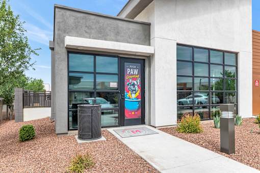 A building with a large window and a sign that says at Marketside Villas at Verrado, Buckeye, AZ