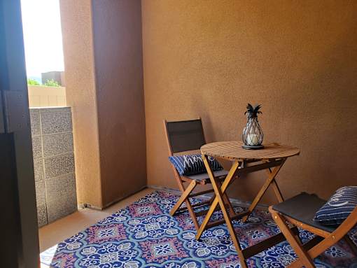 Private patio with outdoor dining furniture at Pinon Lofts Apartments, Sedona