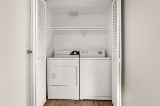 a small laundry room with a washer and dryer at Denim Scottsdale, Arizona