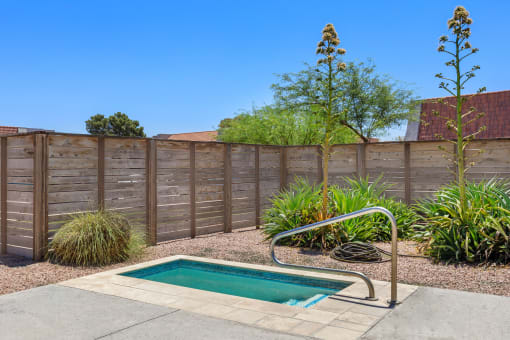 a pool and hot tub in the backyard of a house at Denim Scottsdale, Scottsdale
