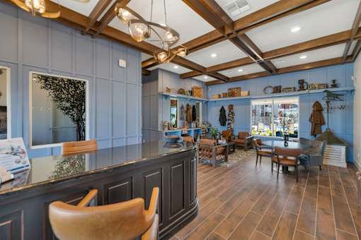 A room with wooden floors and furniture.