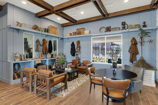 A room with a table and chairs in the middle of it.