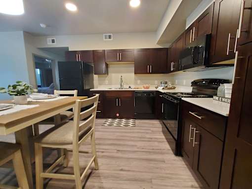 Modern kitchen with dark wood cabinets at Pinon Lofts Apartments, Sedona, AZ 86336