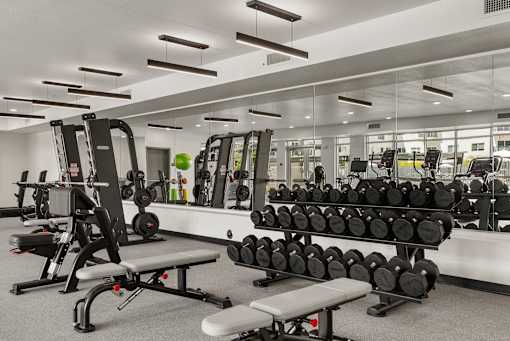 Fitness center with weights and equipment at Lucero Apartments, Arizona, 85051