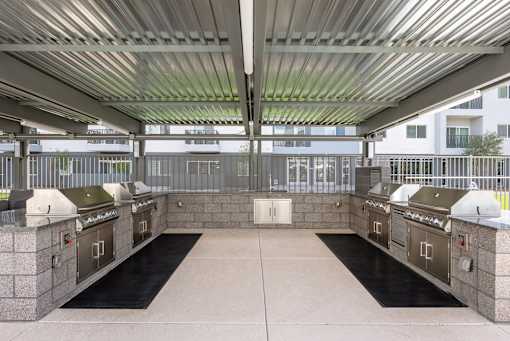 Outdoor grilling stations with covered pavilion at Lucero Apartments, Phoenix, AZ