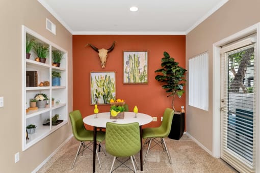 a dining room with a table and chairs      and a window at Montage at Pecos Ranch Apartments, Arizona, 85286