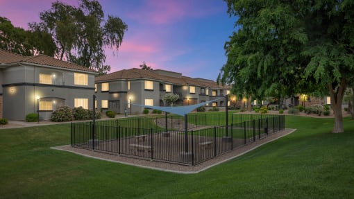 A residential area with houses and a fenced garden at Montage at Pecos Ranch Apartments, Arizona, 85286
