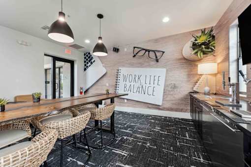A modern office space with a sign that reads at The Laurel Apartments, Arizona, 85286 