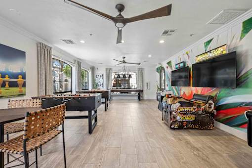 A room with a pool table and a bar area. at Lazo Apartment Homes, Chandler  
