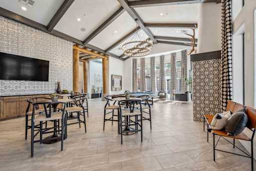 A modern dining room with a large table and chairs. at Lazo Apartment Homes, Arizona  