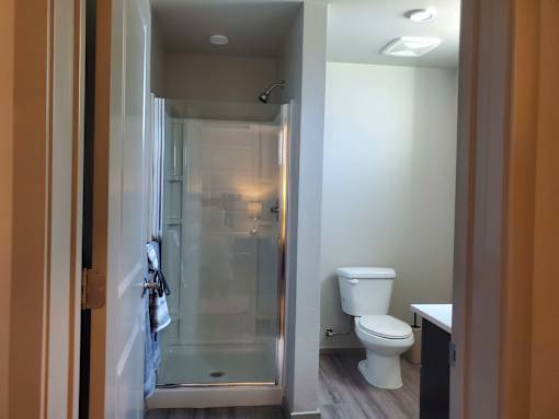 Bathroom with glass shower and modern finishes at Pinon Lofts Apartments, Sedona