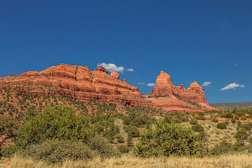 Red rock mountain landscape with desert vegetation at Pinon Lofts Apartments, Sedona, AZ