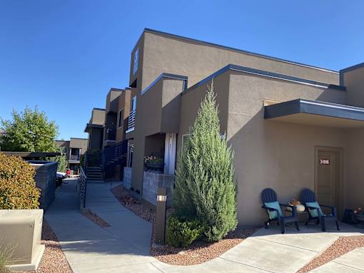 Modern apartment buildings with courtyard walkway at Pinon Lofts Apartments, Sedona, 86336
