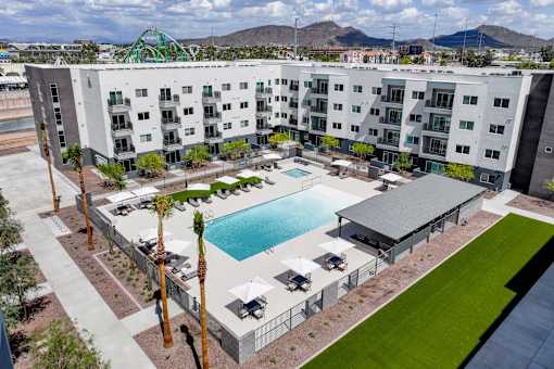 Resort style pool with sundeck and covered pavilion at Lucero Apartments, Arizona